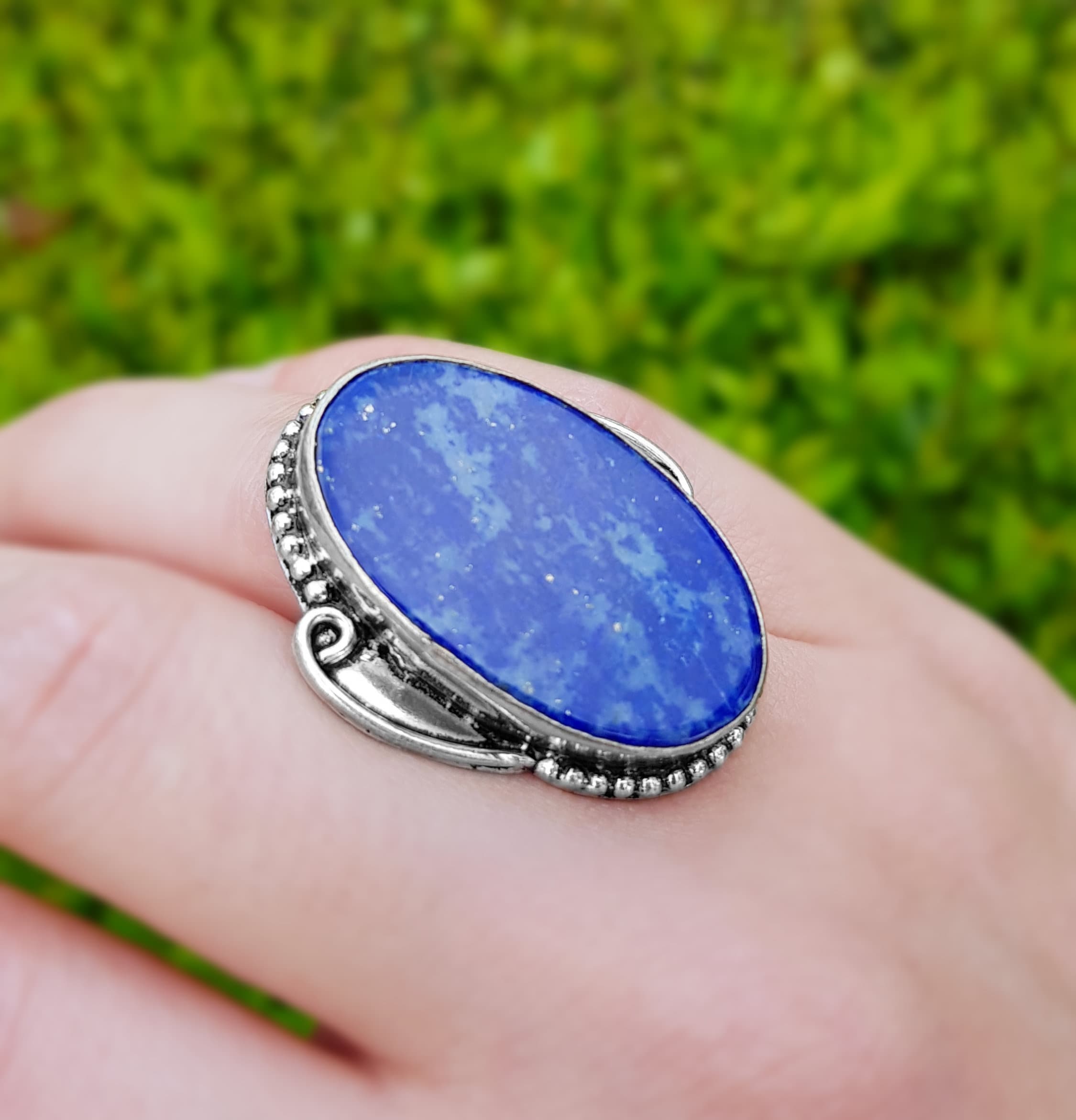 Big silver ring with lapis lazuli. Open ring with deep blue stone. One of sale a kind ring made with silver and blue stone, jagged detail.